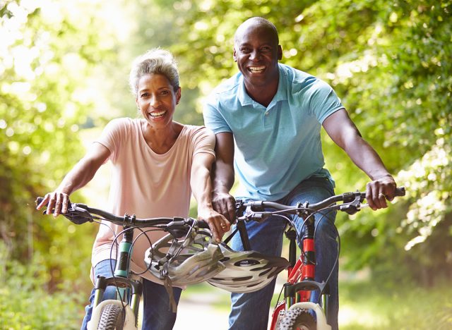 Mature African American Couple On Cycle Ride In Countryside