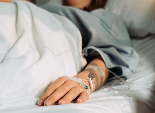 Asian woman lying sick in hospital.
