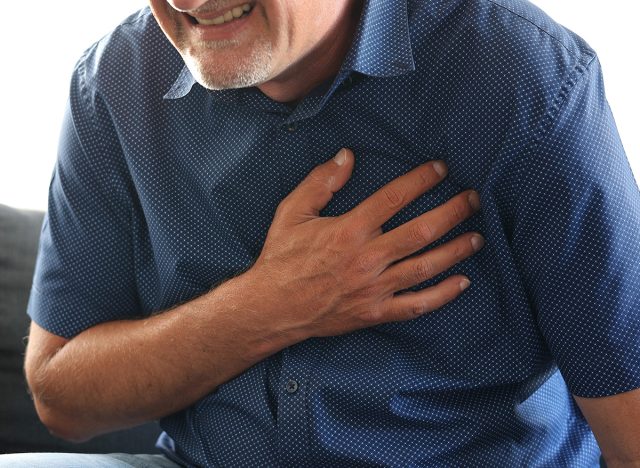 Caucasian man middle age suffering from heart attack at home