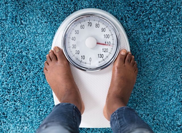 High Angle View Of A Human Foot On Weighing Scale