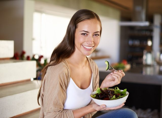 Salad, portrait and happy woman a house with breakfast, bowl or lettuce.