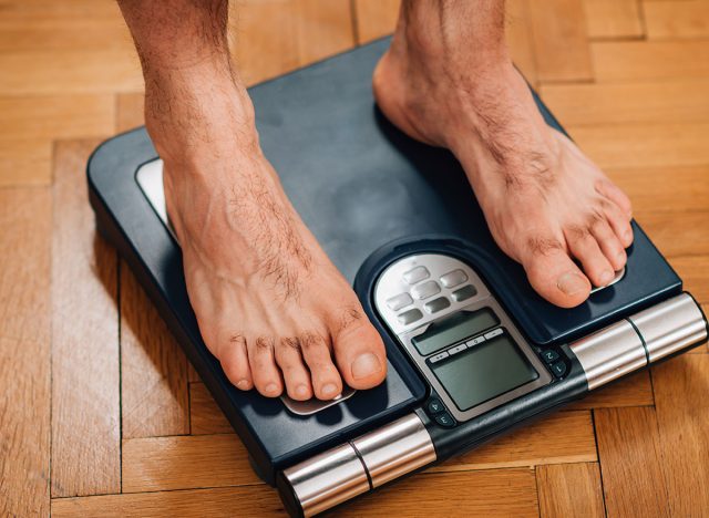 Male athlete measuring Body Composition with Scale