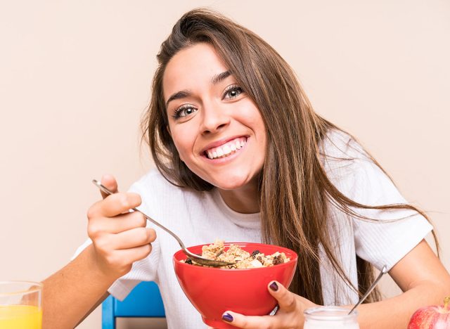 Young caucasian woman having breakfast