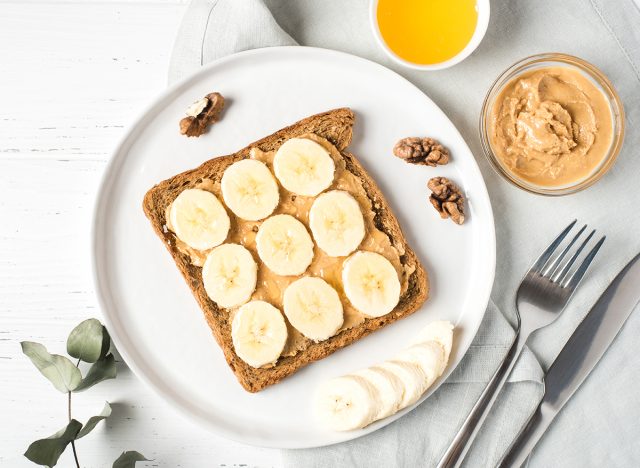 Homemade peanut butter sandwich with bananas and honey.