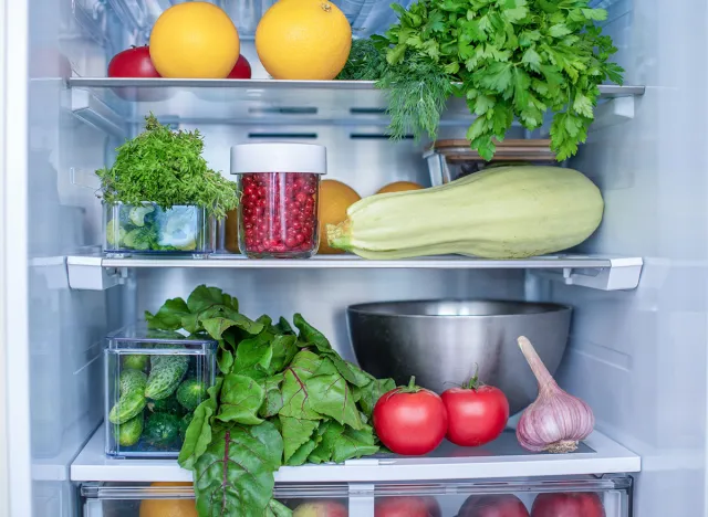 Open fridge full of fresh fruits and vegetables, vegetarian food healthy food background, greenery, organic nutrition, health care, dieting concept.