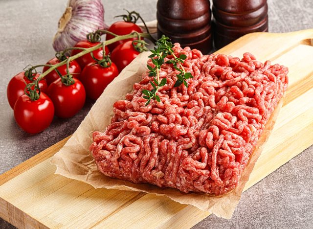 Raw minced beef uncooked meat over board