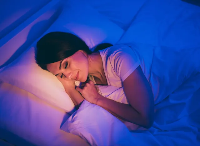 Close-up top above high angle view portrait of her she nice attractive lovely dreamy brunet girl lying in bed covered white blanket head on pillow sleeping peacefully alone at night room house flat