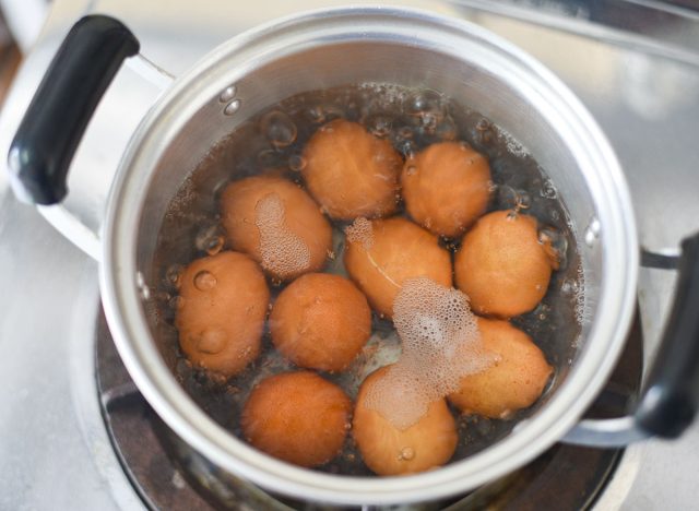 Boiled eggs in a hot pot on the stove, egg cooking healthy eating concept, Eggs menu food