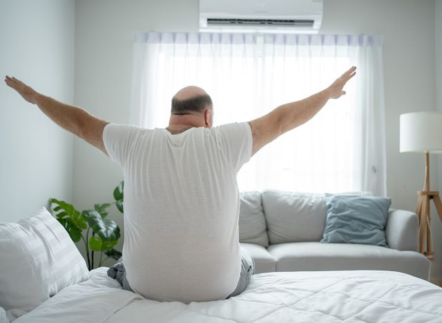 Cozy Morning Routine: Chubby Man Wakes Up and Stretches in Comfortable Home Ambience