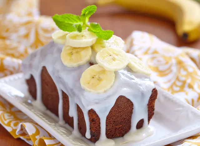 Banana bread with chocolate chips on wooden table