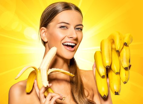 Beautiful young woman with bananas. Tropical fruits. Summer concept. Healthy eating.