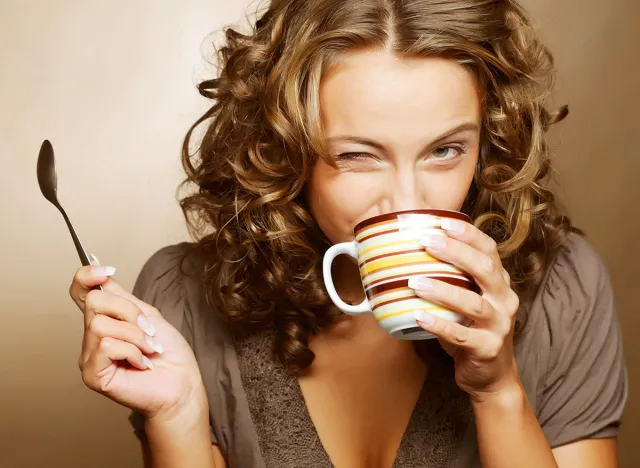 young pretty woman drinking coffee