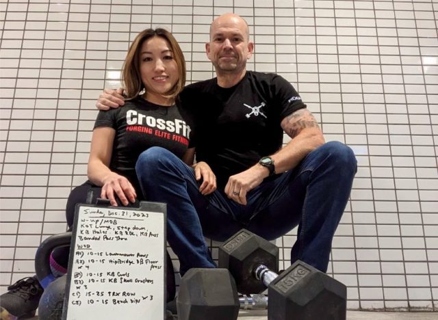 Couple posing at the gym