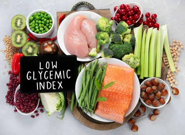 Foods with low glycemic index on gray background. Healthy food concept. Top view, flat lay