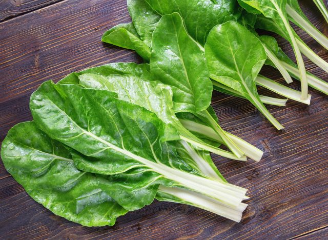 Balkan cuisine. Chard leaves ( blitva ) popular leafy vegetables on dark rustic table