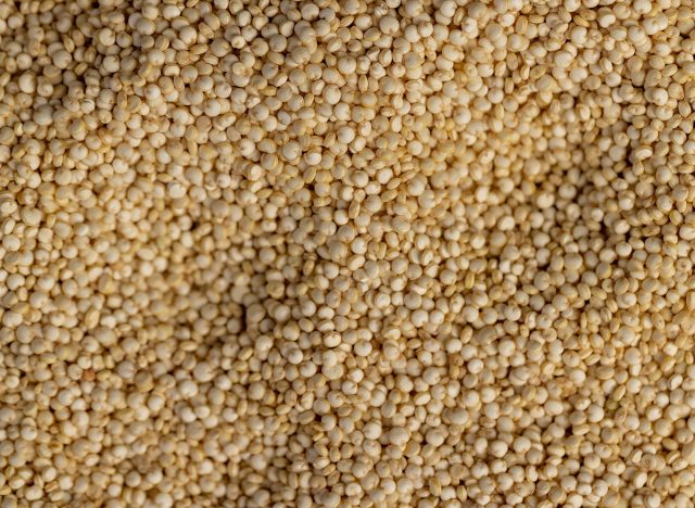 quinoa grains closeup, not cooked healthy quinoa porridge grains