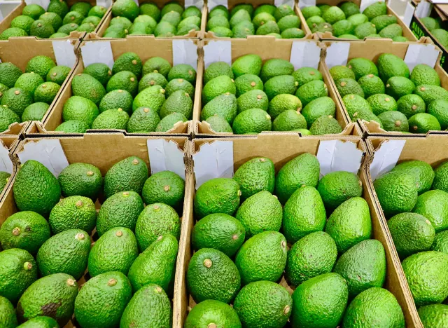 A lot of avocados in boxes