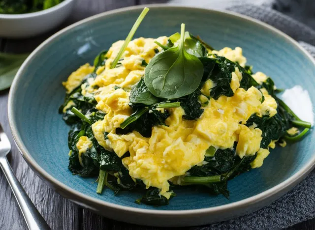 Spinach Scramble: Fluffy scrambled eggs with vibrant spinach, perfectly cooked to showcase the light, nutritious, and fresh qualities of this simple yet satisfying dish.