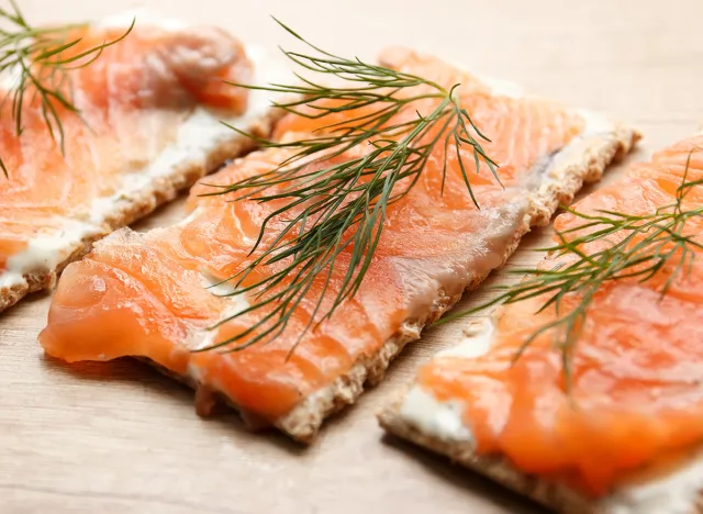 Salted salmon with whole wheat crackers, cream cheese and dill