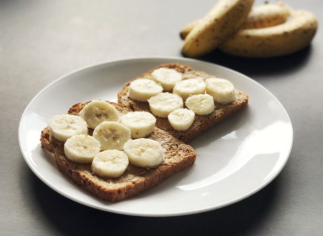 Peanut butter and banana on toast with selective focus