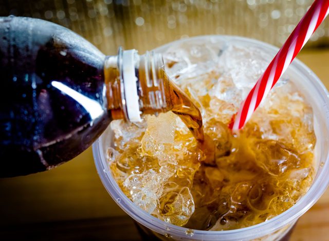 Refreshing Bubbly Soda Pop with Ice Cubes. Cold soda iced drink in a glasses - Selective focus, shallow DOF.