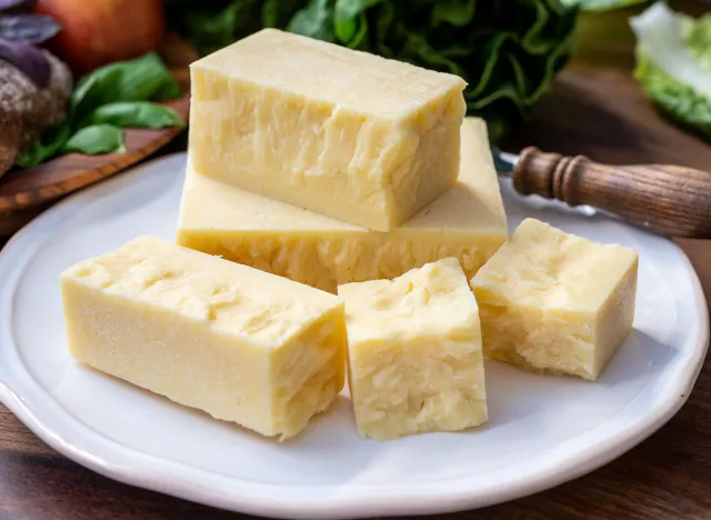 Cheese collection, pieces of aged British cheddar cheese close up