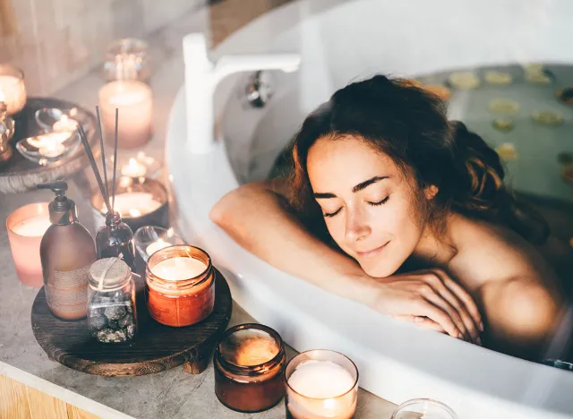 Beautiful woman relaxing at spa. Young lady relaxing in jacuzzi.