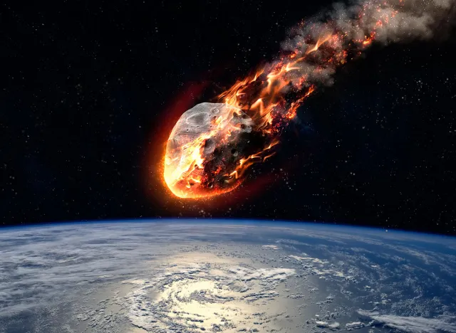 A Meteor glowing as it enters the Earth's atmosphere. Elements of this image furnished by NASA