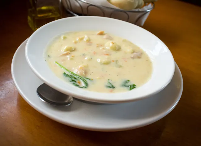 Creamy chicken gnocchi traditional Italian soup with bread and oilve oil