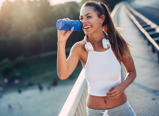 Portrait of woman taking break from jogging