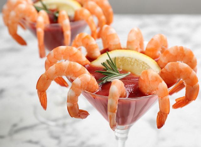 Delicious shrimp cocktail with tomato sauce, closeup