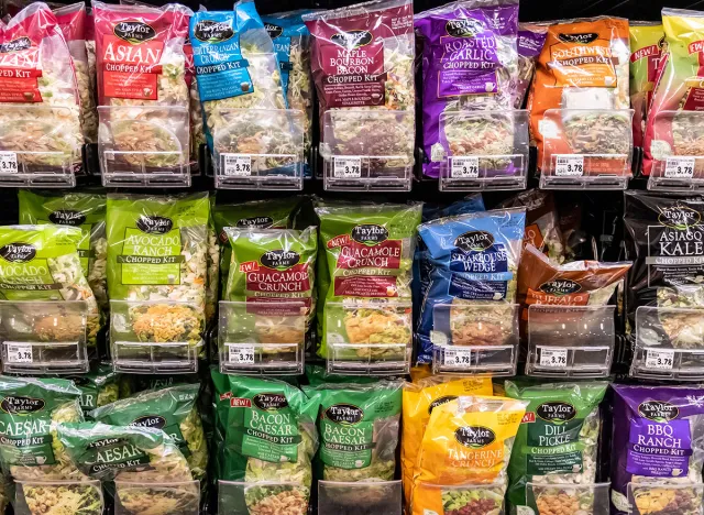 Woodland, CA, USA November 1st 2021 Taylor brands Bagged assorted organic salads kits for sale in a supermarket aisle