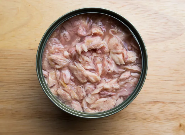 Canned tuna on wood background