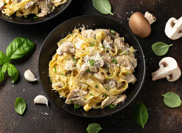 Creamy Alfredo pasta with chicken, mushrooms and parmesan cheese. Healthy Italian food