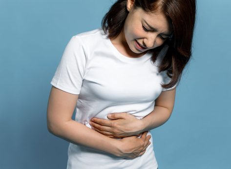 young woman having a stomachache