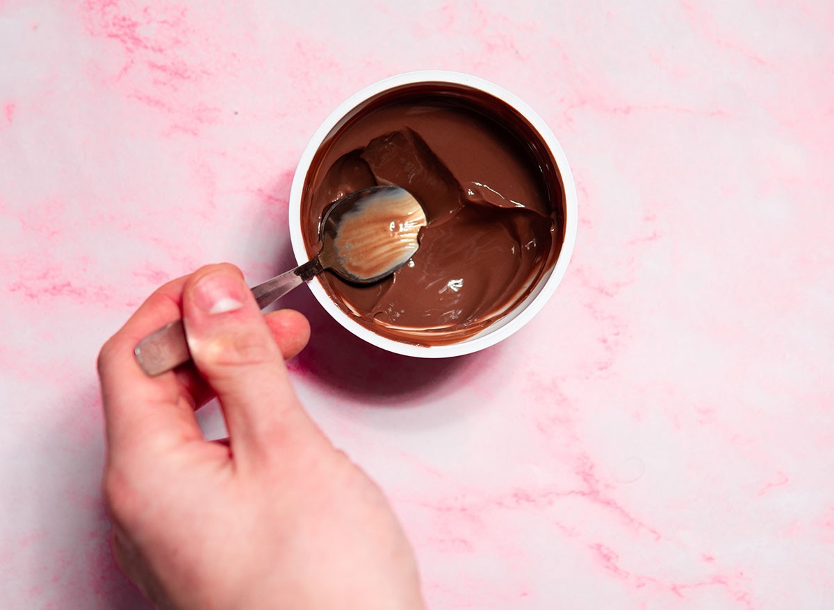 top view of chocolate protein pudding. Eating a healthy sweet dessert