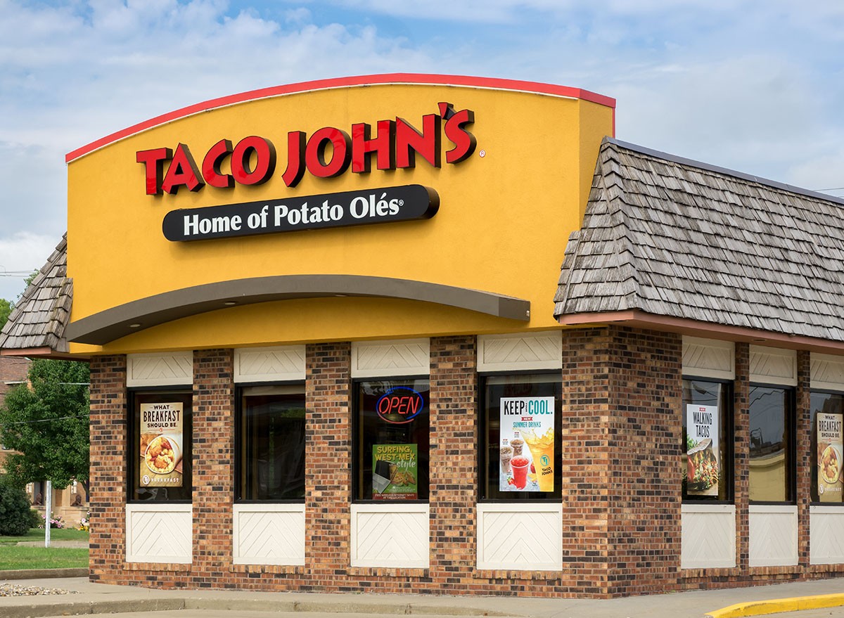 Taco John's exterior and sign. Taco John's is fast-food restaurant featuring Mexican-inspired fast-food.