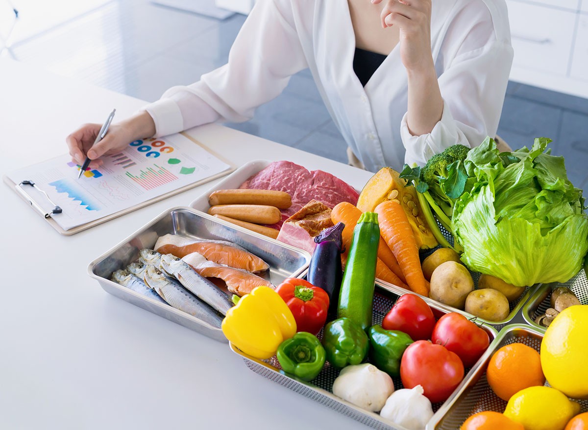 Young woman and foodstuff. Food coordinator. Nutritionist.