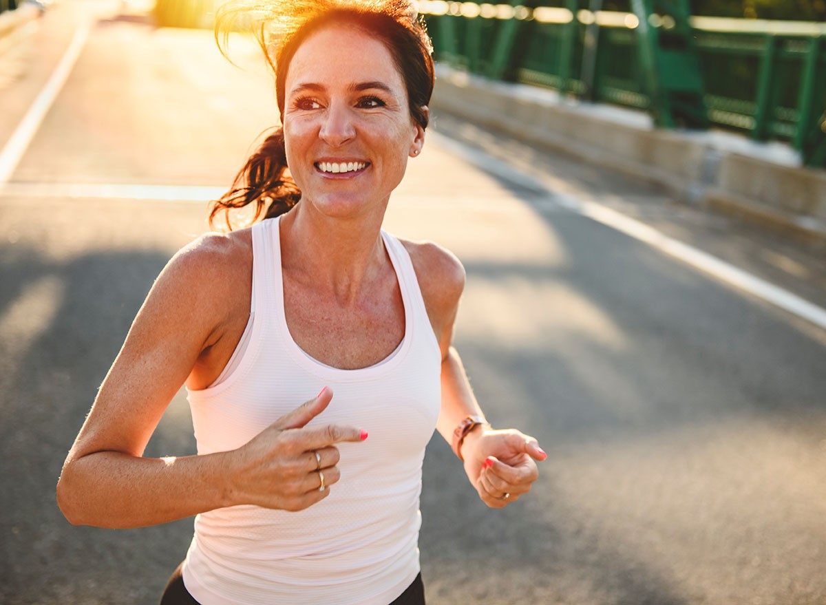 mature,Woman,Jogging,Outdoors,On,Sunset,sunrise, morning, running