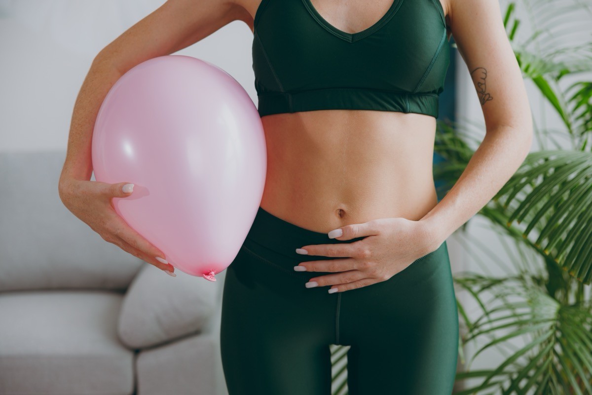 Cropped,Close,Up,Young,Strong,Sporty,Athletic,Fitness,Trainer,Instructor, bloating, bloated, tummy, gut