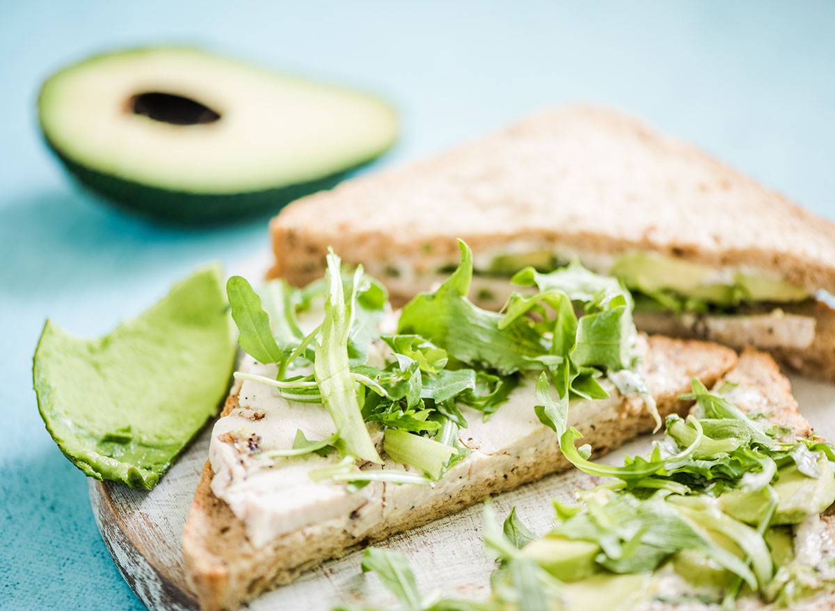 Healthy sandwich with avocado and chicken and salad
