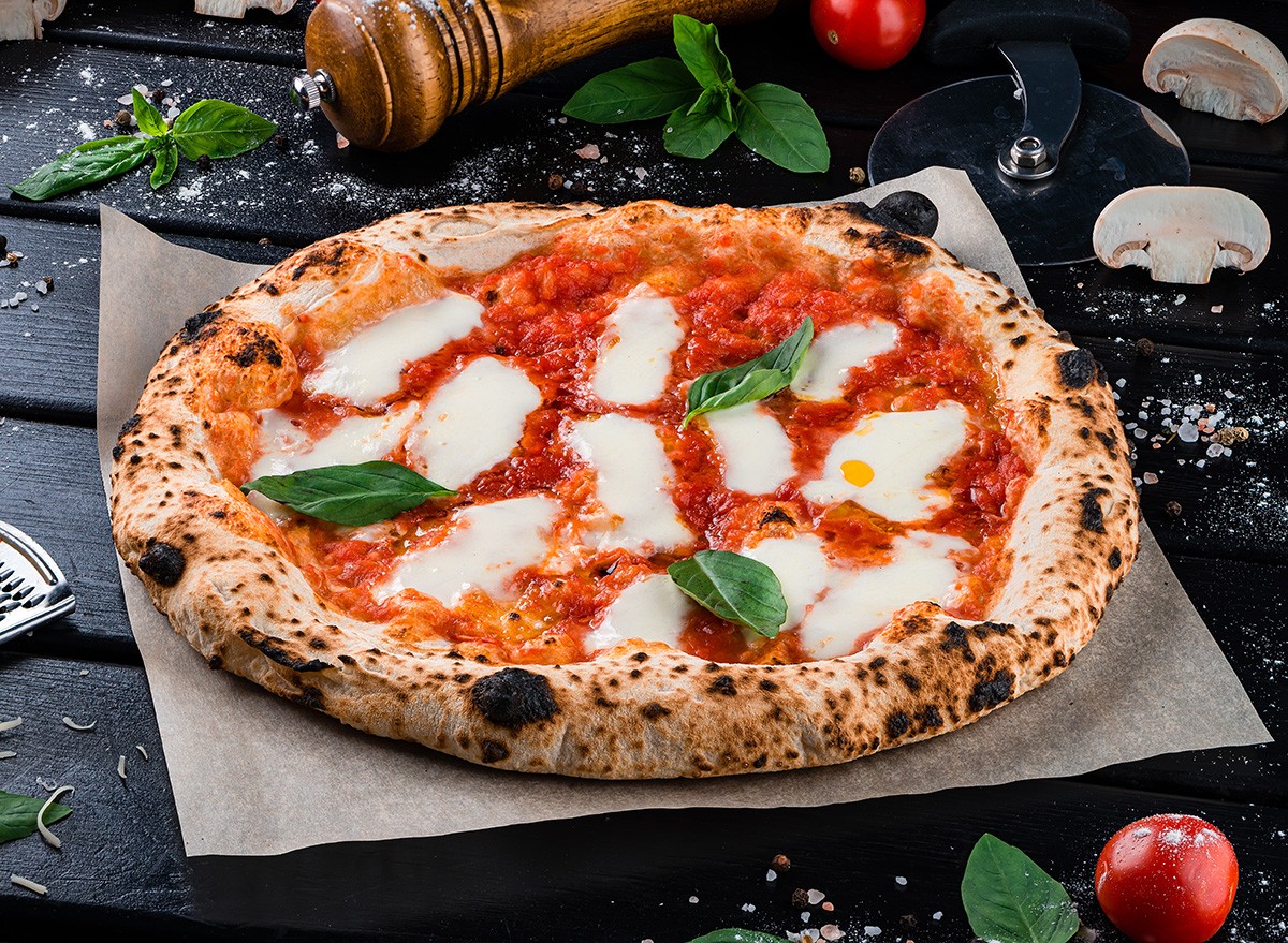 Neapolitan,Pizza,With,Spices,,Tomatoes,And,Cheese,Mozzarella,On,Dark