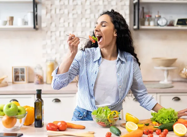 Young,Woman,Eating,Salad,Organic,Vegetables,happy,eating,food
