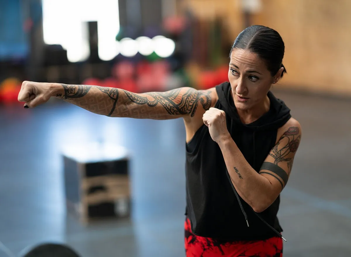 Woman shadowboxing in a cross training gym