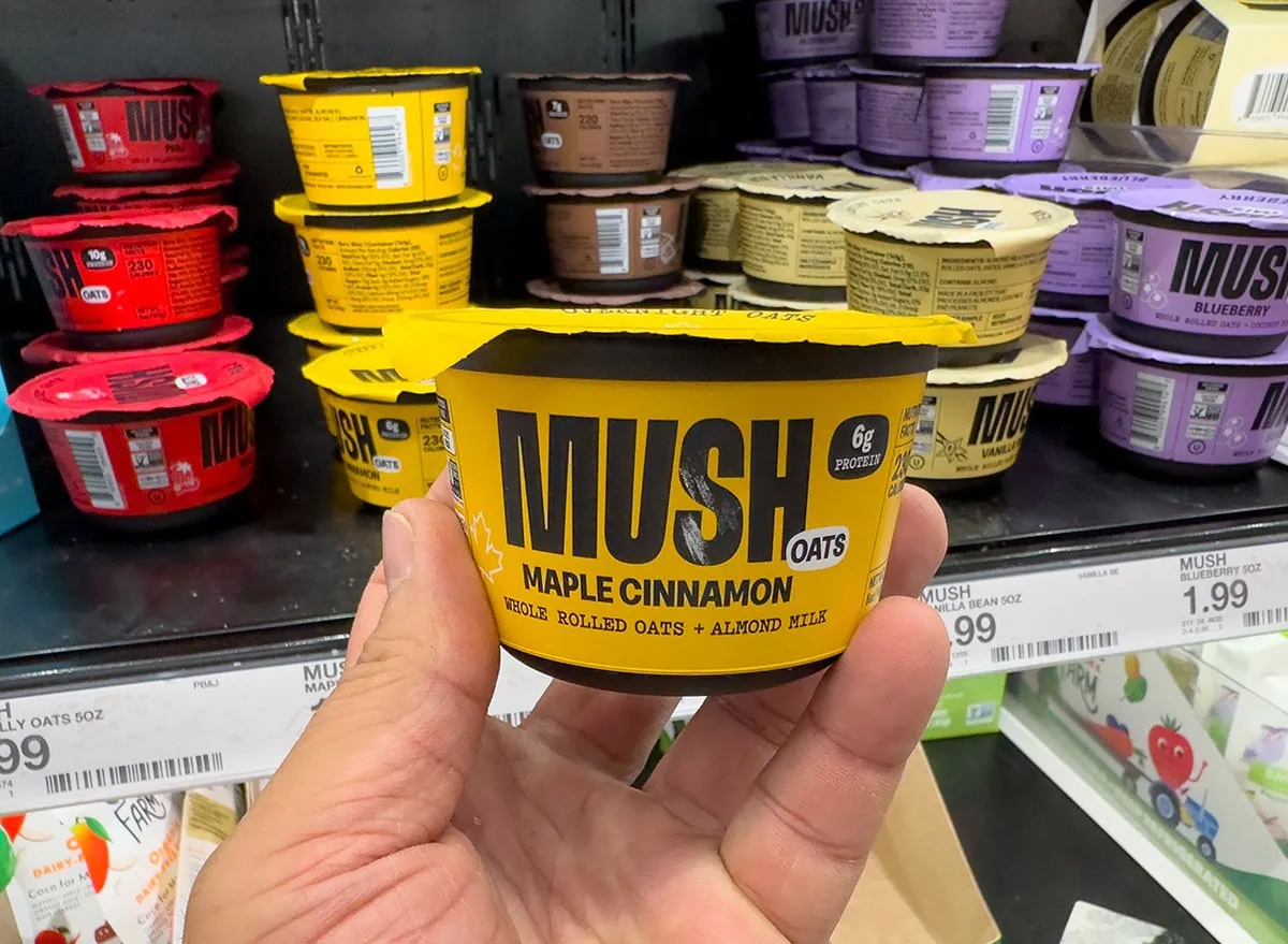Los Angeles, California, United States - 08-16-2023: A view of a hand holding a package of Mush Oats, on display at a local grocery store.