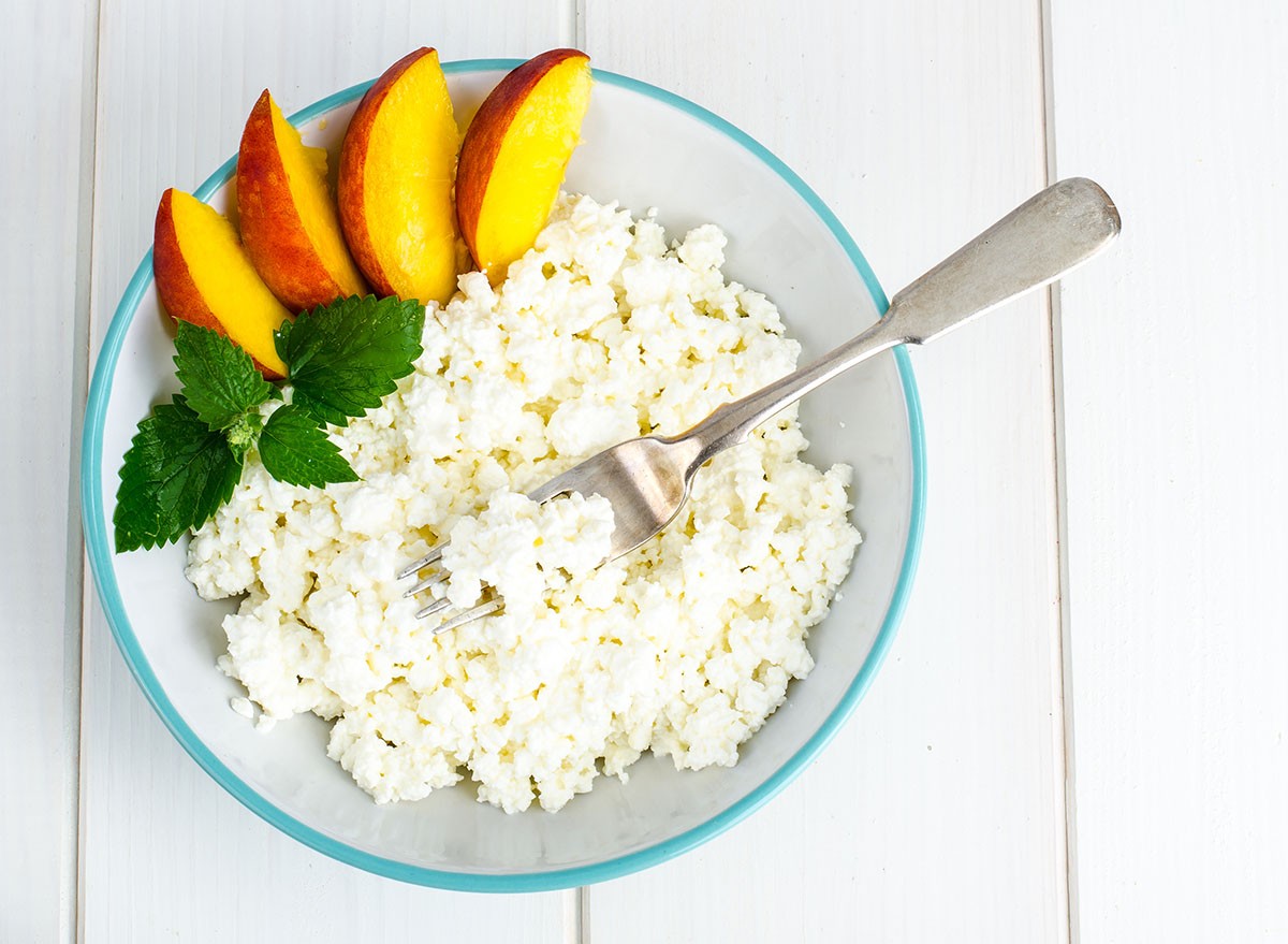 Fresh cottage cheese with fruit for breakfast. Studio Photo