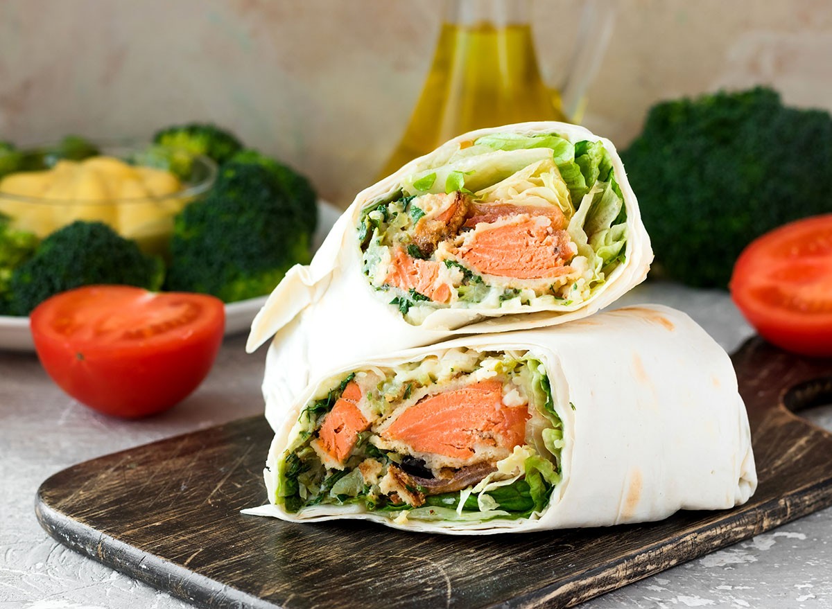 Rolls with salmon and greens in pita bread