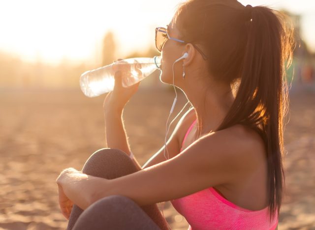Beautiful,Fitness,Athlete,Woman,Drinking,Water,After,Work,Out,Exercising