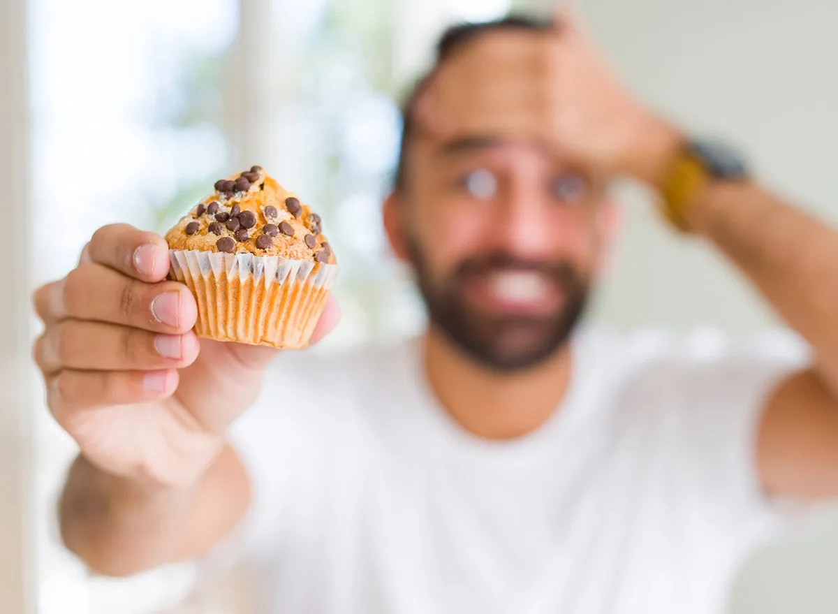 Man,Eating,Chocolate,Chips,Muffin,sad,worried,diet,breakfast