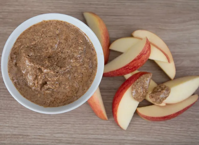 Almond Butter in Small White Bowl and Apple Slices for Snacking